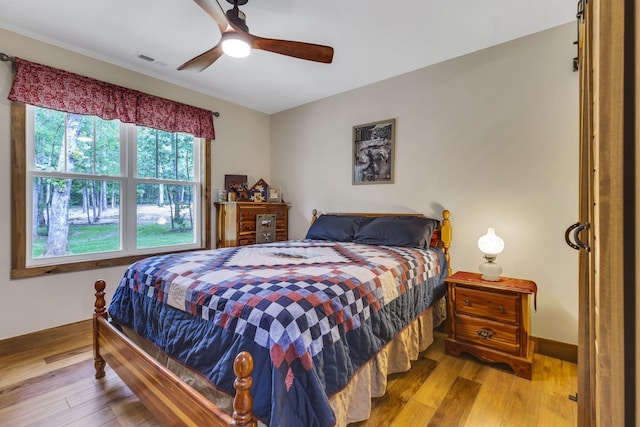 bedroom featuring ceiling fan and hardwood / wood-style flooring