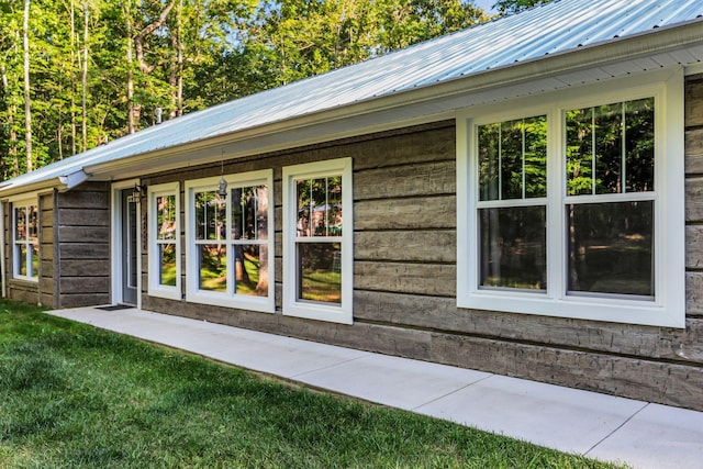 view of property exterior featuring a yard