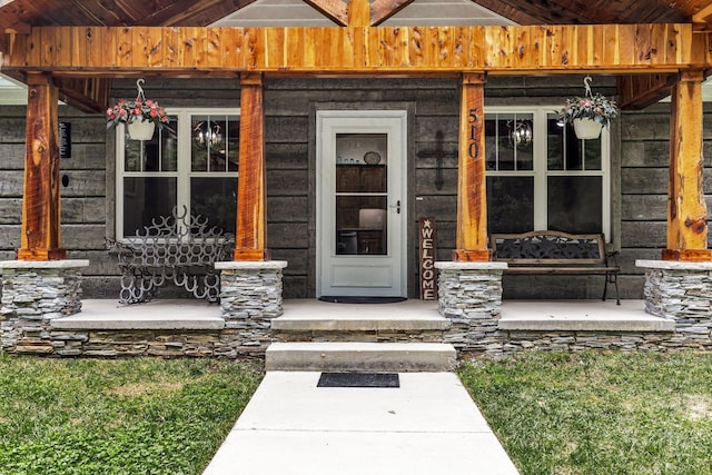 doorway to property with a porch