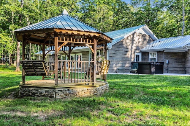 view of home's community featuring a yard and a wooden deck