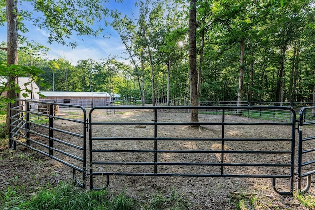 view of gate with an outdoor structure