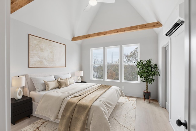 bedroom with high vaulted ceiling, a wall mounted AC, ceiling fan, and light hardwood / wood-style flooring