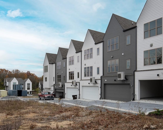 view of front of home featuring ac unit