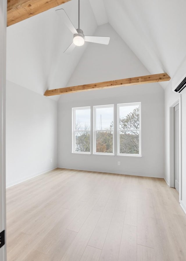 interior space with light wood-type flooring, ceiling fan, and vaulted ceiling with beams