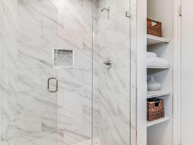 bathroom featuring an enclosed shower