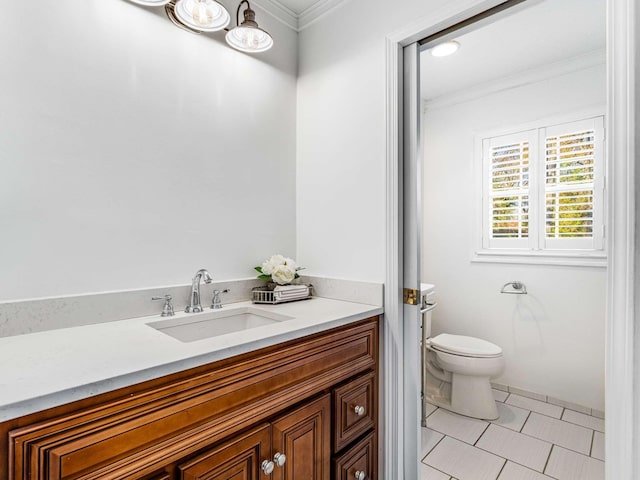 bathroom with ornamental molding, tile patterned flooring, vanity, and toilet