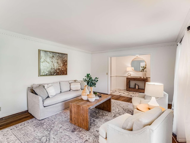 living room with light wood-type flooring and crown molding