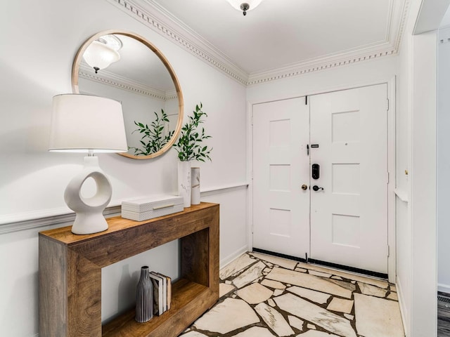 foyer entrance featuring crown molding