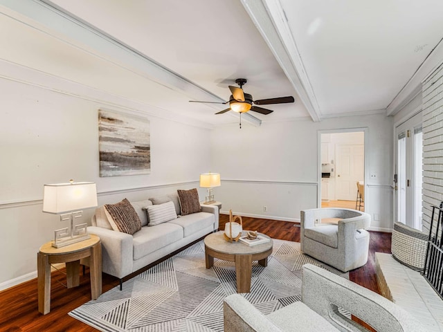 living room featuring wood-type flooring, ceiling fan, crown molding, and beamed ceiling