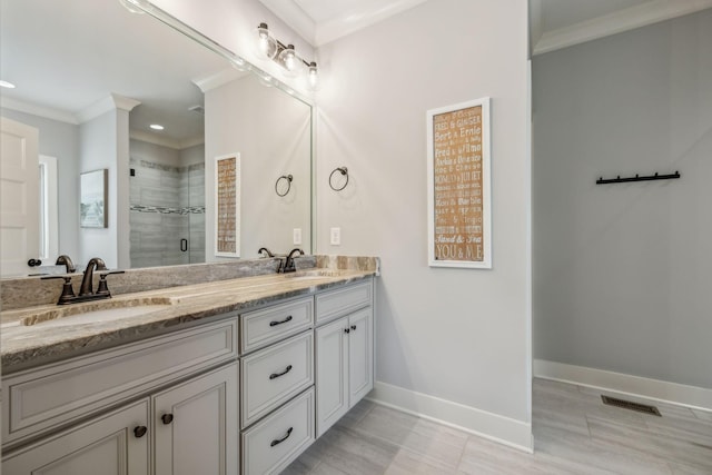 bathroom with vanity, walk in shower, tile patterned floors, and ornamental molding