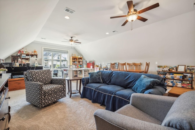 living room featuring ceiling fan, light colored carpet, and lofted ceiling