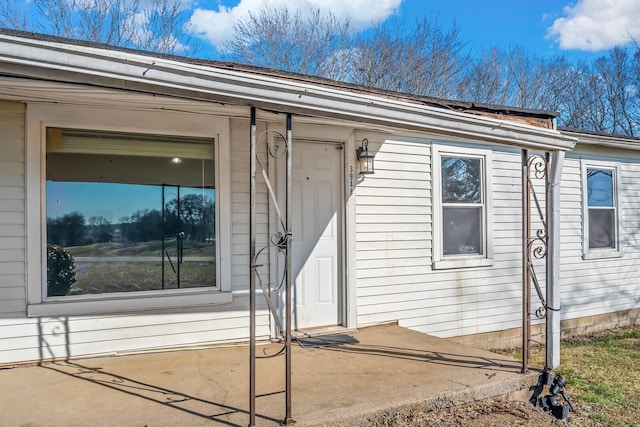 property entrance featuring a patio