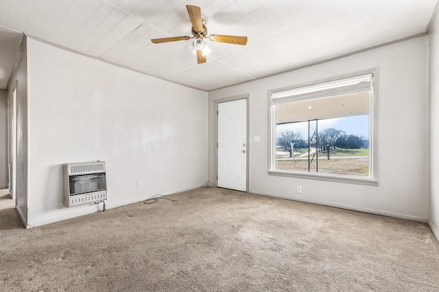 unfurnished living room featuring ceiling fan, wood ceiling, heating unit, and carpet flooring