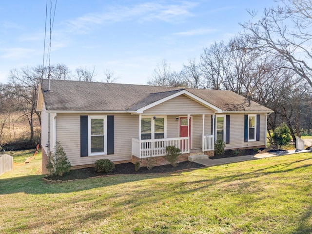 ranch-style home with a front yard and a porch