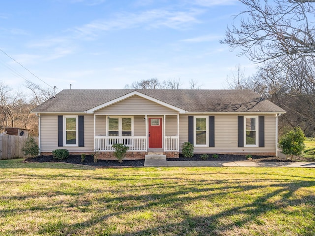 ranch-style home with a front yard and covered porch