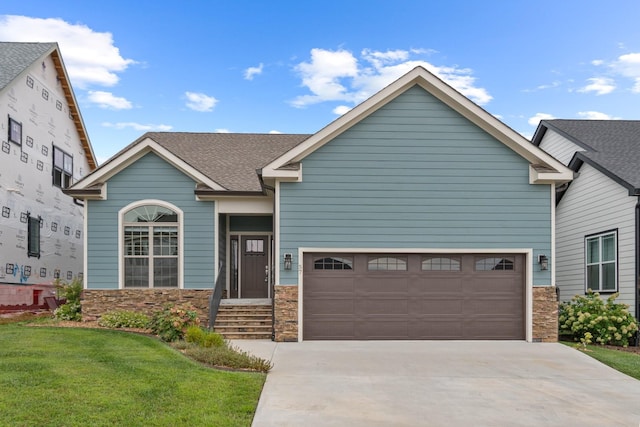 craftsman inspired home with a front yard and a garage