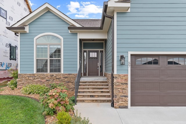 entrance to property featuring a garage