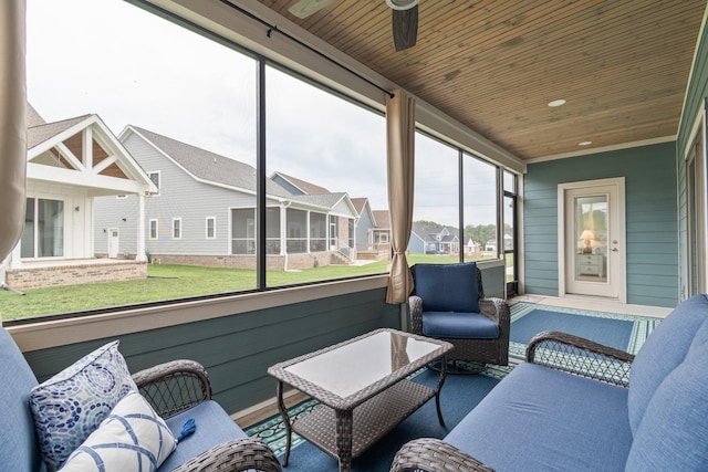 sunroom / solarium featuring wooden ceiling and ceiling fan