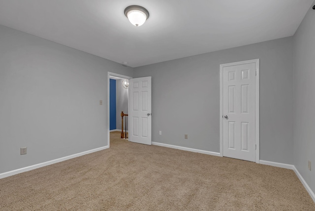 unfurnished bedroom featuring carpet