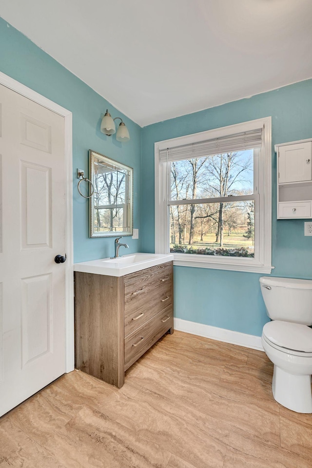 bathroom with toilet and vanity