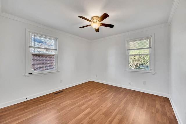 unfurnished room featuring ceiling fan, light hardwood / wood-style flooring, and ornamental molding