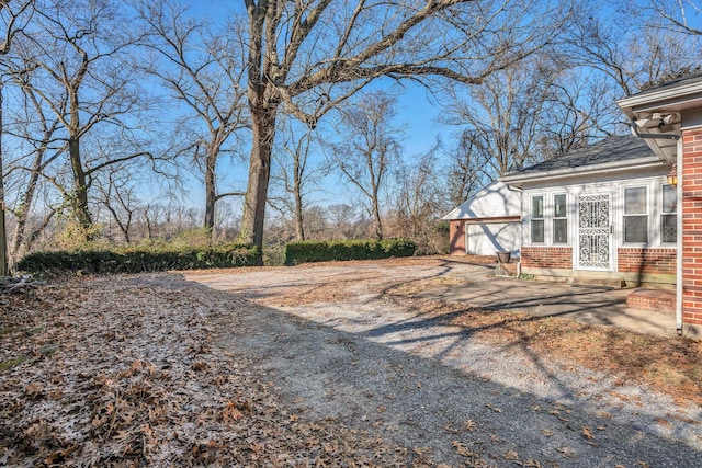 view of yard with a garage