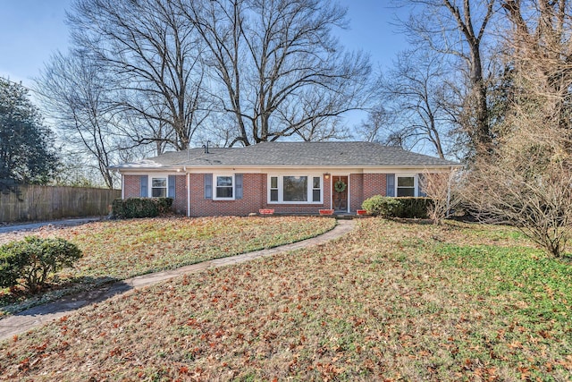 ranch-style home with a front yard