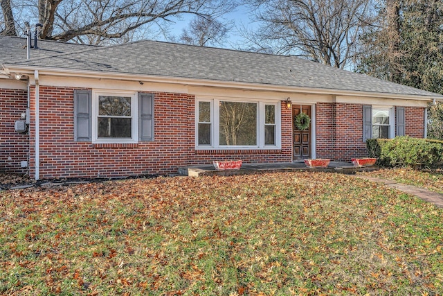 ranch-style home with a front yard