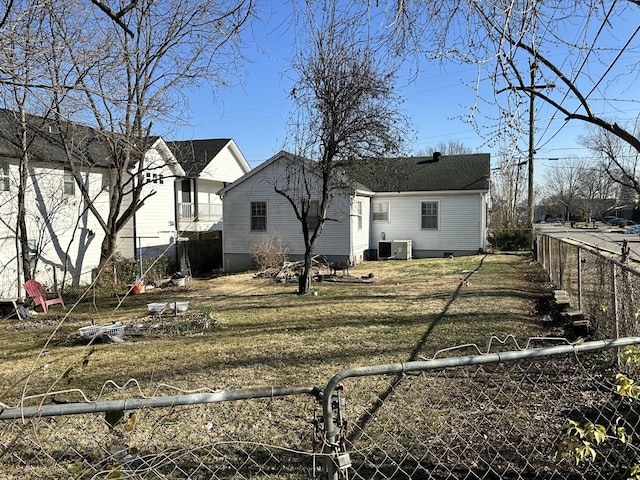 back of house featuring cooling unit