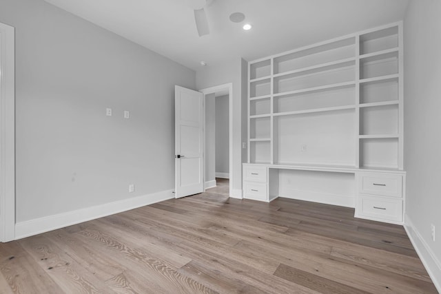 unfurnished bedroom featuring ceiling fan and light hardwood / wood-style flooring