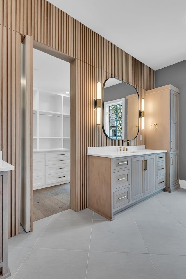 bathroom with tile patterned flooring and vanity