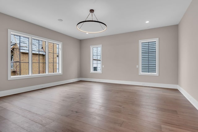 spare room featuring light hardwood / wood-style floors