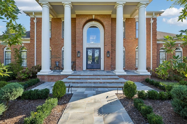 doorway to property featuring covered porch