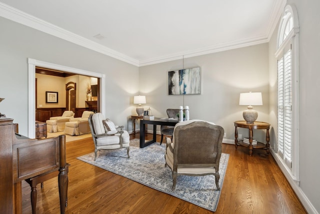 living room with crown molding and wood-type flooring