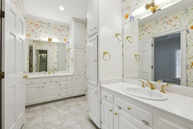 bathroom featuring ornamental molding, tile patterned flooring, and vanity