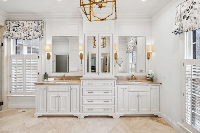 bathroom featuring vanity, tile patterned flooring, a chandelier, and crown molding