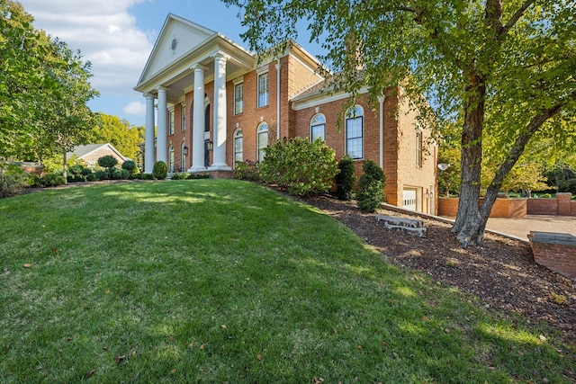 neoclassical home with a front yard