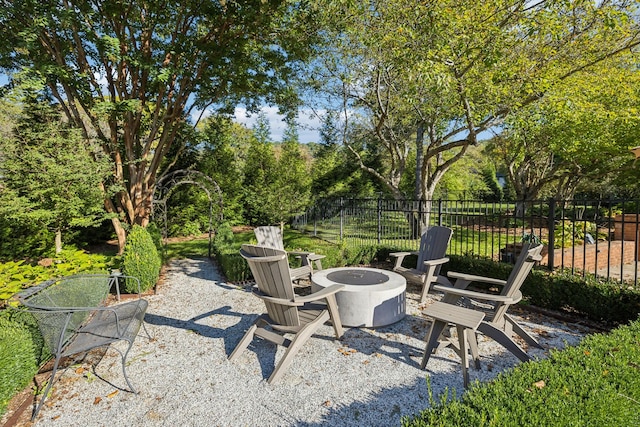 view of patio / terrace featuring an outdoor fire pit