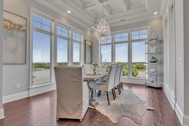 dining space with coffered ceiling, an inviting chandelier, crown molding, and beamed ceiling