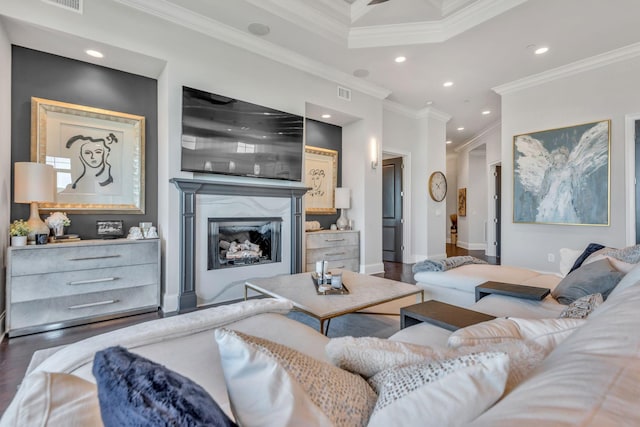 living room featuring ornamental molding, dark wood-type flooring, and a fireplace