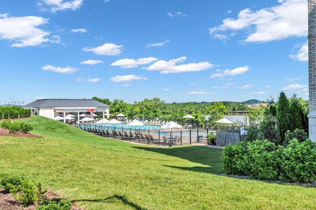 view of yard with a community pool