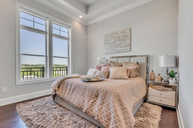 bedroom featuring ornamental molding and dark hardwood / wood-style floors