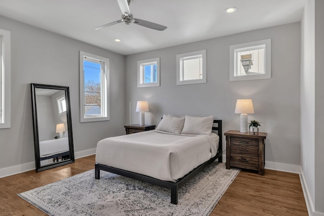 bedroom featuring ceiling fan and wood-type flooring