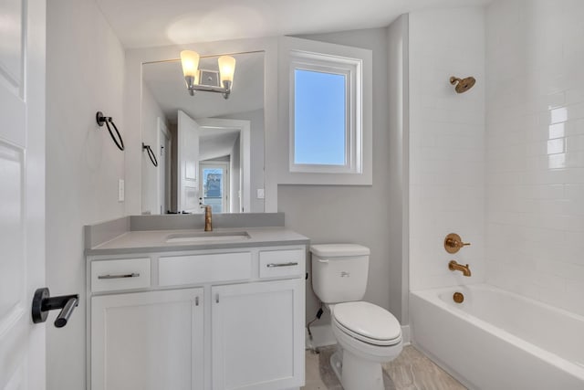 full bathroom featuring vanity, toilet, and tiled shower / bath combo