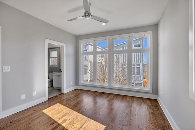 spare room with ceiling fan and hardwood / wood-style floors