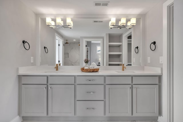 bathroom with vanity, walk in shower, and an inviting chandelier