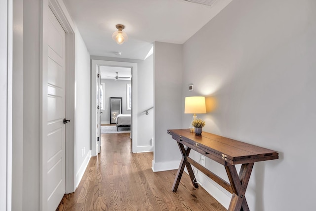 corridor featuring light hardwood / wood-style floors