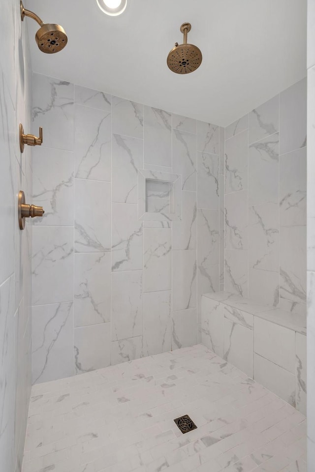 bathroom with tiled shower