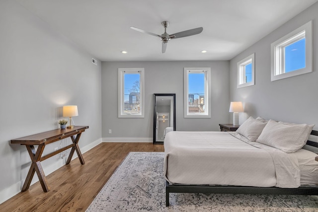 bedroom featuring wood-type flooring and ceiling fan