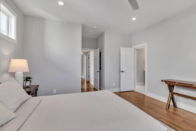 bedroom with dark wood-type flooring and ceiling fan